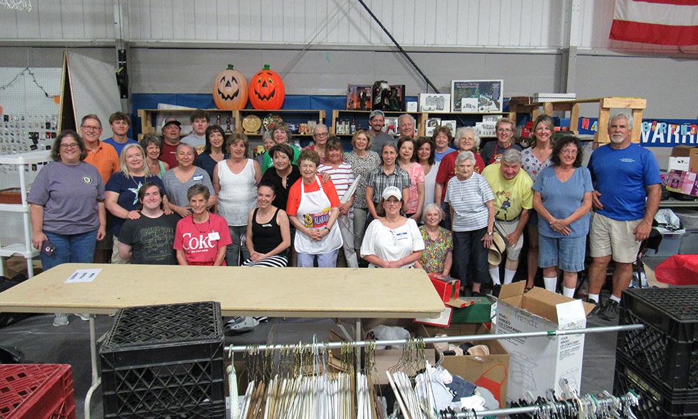 Volunteers prepare OLS July 4th Festival